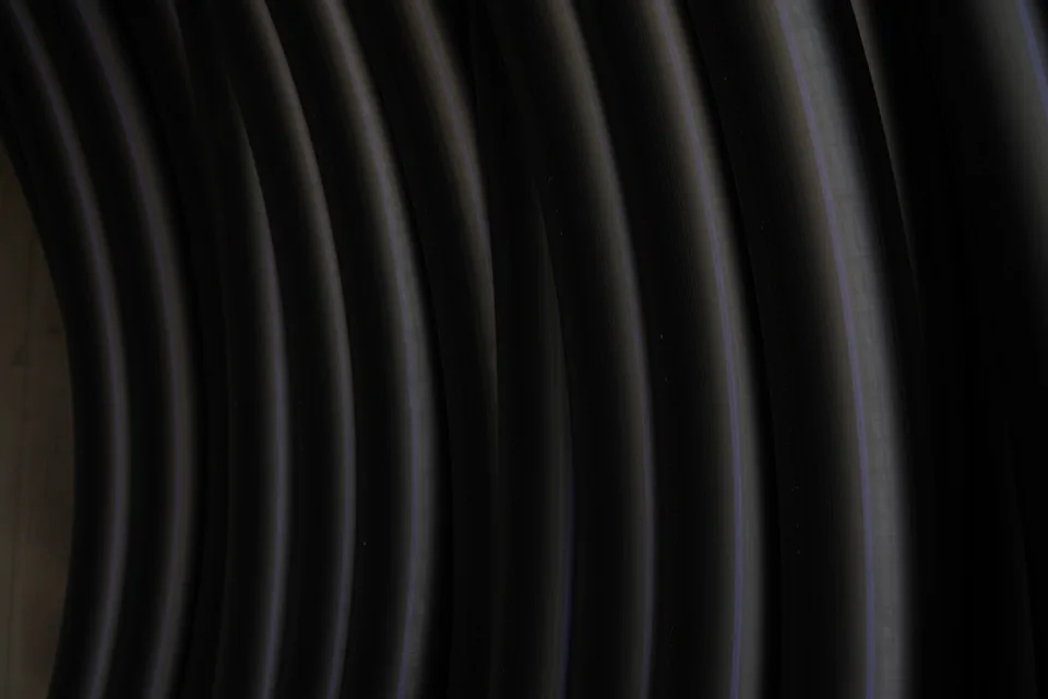 Coiled polyethylene pipes ready for storage at Bukan Pipe