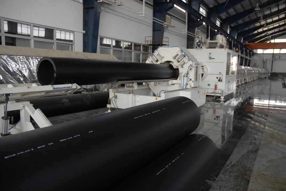Polyethylene pipe products in the open yard at Bukan Pipe