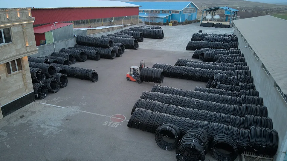 Coiled polyethylene pipes ready for storage at Bukan Pipe
